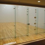 movable glass wall for racquetball courts and squash courts