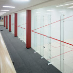 movable glass wall system for racquetball courts